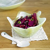 Beetroot salad with pomegranate seeds and spring onions