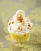 A banoffee cupcake with caramel drizzle
