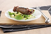 Caramelised beef roulade on courgette salad