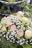 Arrangement of roses and gypsophila