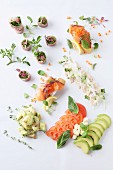 Various canapés with salmon, vegetables and herbs