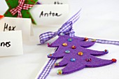 Felt Christmas tree decorated with sequins as festive napkin decoration