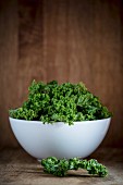 Fresh kale in a porcelain bowl
