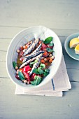 Anchovies with a chickpea medley and mint