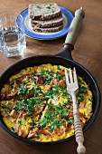 Omelette with ham, vegetables and tomatoes