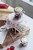 Wrapped gifts and jam jars with hand-written labels