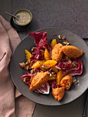 Chicory salad with lentil falafel, pecan nuts and oranges