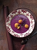Foamy red cabbage soup with crispy baked sheep's cheese balls