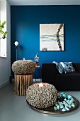 Blue wall and coral-shaped ornaments in living room
