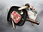 Wagyu ribeye steak with rosemary and garlic in a grill pan