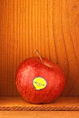 An organic apple in wooden crate