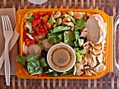 Chinese chicken salad in a plastic box