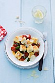 Ricotta dumplings with tomatoes and basil