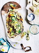 Yoghurt flatbread with courgette, courgette flowers and feta
