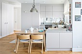 Bright, open-plan fitted kitchen with integrated dining area