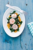 Sole and salmon rolls with spinach and pumpkin sauce