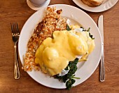 Eggs Benedict with spinach and omelette