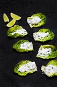 Lettuce leaves topped with a pea and mint cream