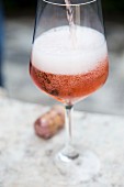 Prosecco rose being poured into a glass