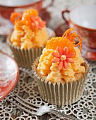 Mandarin cupcakes decorated with sugar flowers