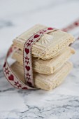 A stack of Springerle biscuits with a ribbon