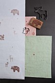 Hand-made festive gift wrap decorated with stamped woodland animal motifs