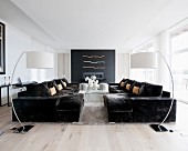 Symmetrical arrangement of sofas and arc lamps in living room