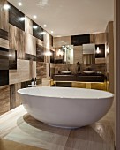 Masculine bathroom with free-standing bathtub and chequered wall tiles