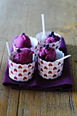 Blueberry ice cream in dessert cups decorated with hearts