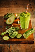 A green smoothie with almond milk, cucumber, avocado and kohlrabi leaves