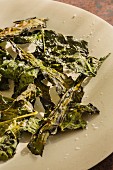 Oven-baked kale leaves with oil, vinegar and salt