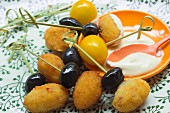 Baked olives with garlic sauce