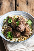 Ostrich meatballs on a bed of couscous with dukkah