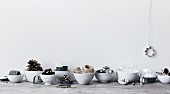 Craft utensils for Christmas decorations in white china bowls