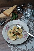 Spinach and ricotta ravioli with sage butter and walnuts