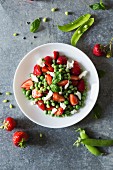 Pea salad with fresh strawberries and mozzarella (seen from above)