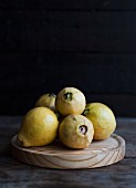 Guavas on a wooden board