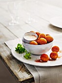 Potato croquettes with paprika and sour cream dip