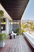 Large modern balcony with wooden board floor