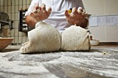 Bread dough being kneaded in a bakery