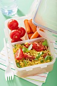Couscous salad and mini vegetables in a lunchbox