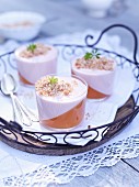 Glases of rhubarb mousse with woodruff
