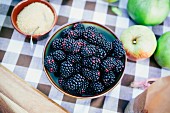 Fresh blackberries, apples and sugar