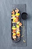 Tuna and mango skewers with spring onions