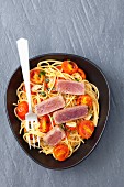 Spaghetti with cherry tomatoes and tuna steak