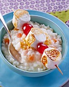 Rice pudding with a grilled marshmallow skewer