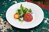 Raw minced meat with a salad garnish