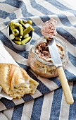 A jar of Breton Pate de campagne with cornichons and baguette