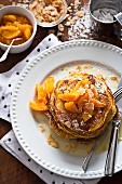 Buttermilk pancakes with oranges and flaked almonds