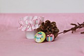 Pine cones, beaker with ruched ribbon & festive badges